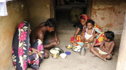 A tribal family having a meal together